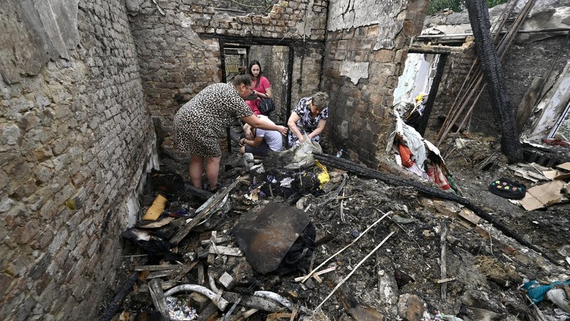 Women search the ruins of a house for surviving items after a Russian Shahed drone falls onto a residential area in Zaporizhzhia, Ukraine, on August 27, 2024. NO USE RUSSIA. NO USE BELARUS. (Photo by Ukrinform/NurPhoto via Getty Images) NurPhoto