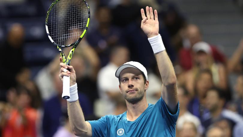 Botic van De Zandschulp celebrates after defeating Carlos Alcaraz at the US Open.