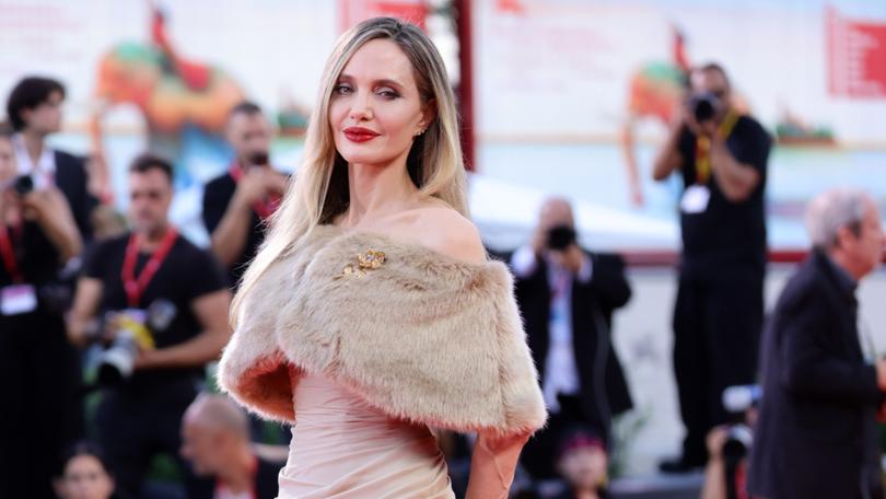 Angelina Jolie on the red carpet for the series "Maria" at the Venice International Film Festival.