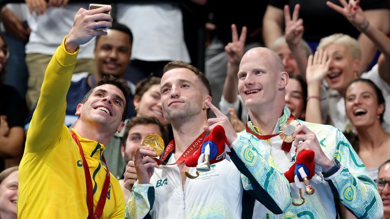 Silver medallist Phelipe Andrews Melo Rodrigues of Brazil, gold medallist Thomas Gallagher and bronze medalist Rowan Crothers of Team Australia take a selfie.