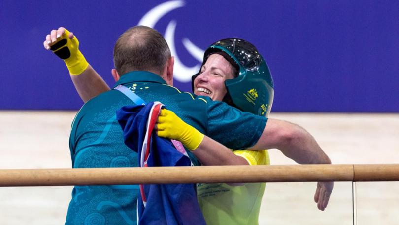 Emily Petricola, of Australia, is overjoyed after winning the Women's C4 3000m Individual Pursuit.   (AAP PHOTOS)