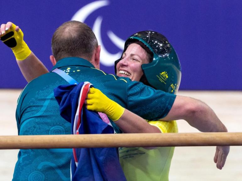 Emily Petricola, of Australia, is overjoyed after winning the Women's C4 3000m Individual Pursuit.   (AAP PHOTOS)