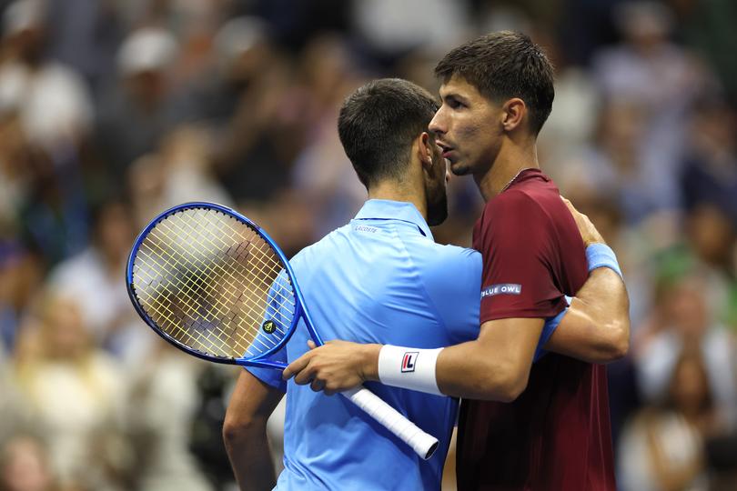 NEW YORK, NEW YORK - AUGUST 30: (R) Alexei Popyrin of Australia shakes hands with Novak Djokovic of Serbia after winning their Men's Singles Third Round match on Day Five of the 2024 US Open at USTA Billie Jean King National Tennis Center on August 30, 2024 in the Flushing neighborhood of the Queens borough of New York City. (Photo by Sarah Stier/Getty Images)