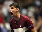 Alexei Popyrin of Australia reacts after defeating Novak Djokovic of Serbia.