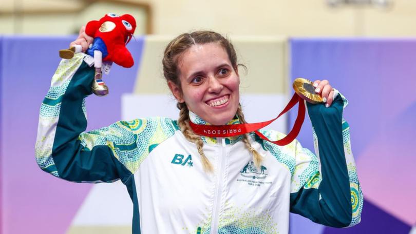 AmandaReid of Australia on the podium after winning gold in the C1-3 500m time trial. (Greg Smith/AAP PHOTOS)