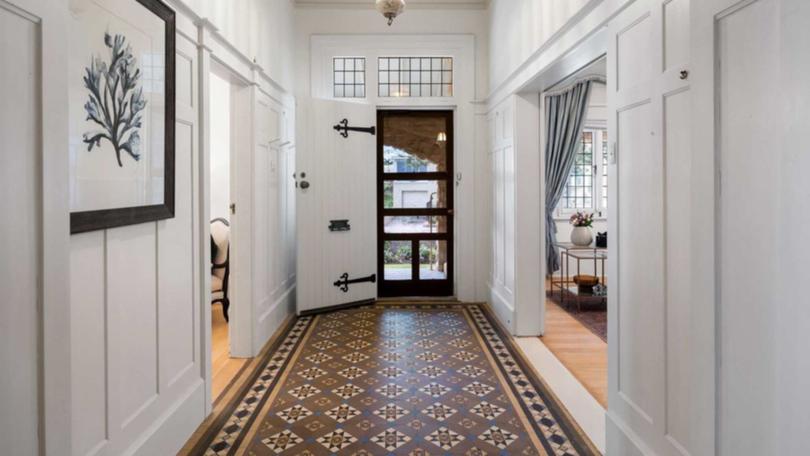 The property has generous proportions including the impressive entry hall.