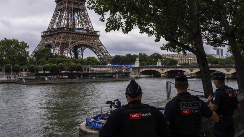 Concerns about water quality in the Seine led to the postponement of Paralympic triathlon events. (AP PHOTO)