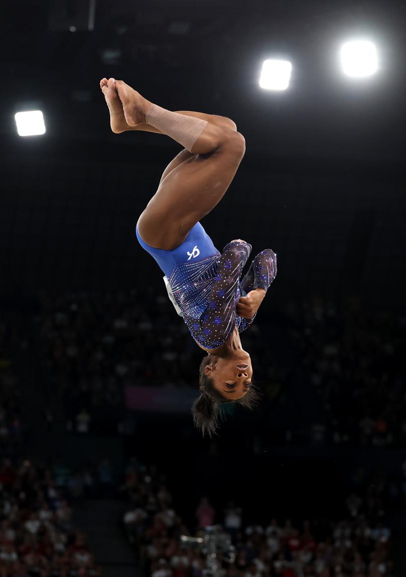 PARIS, FRANCE - AUGUST 01: Simone Biles of Team United States competes in the floor exercise during the Artistic Gymnastics Women's All-Around Final on day six of the Olympic Games Paris 2024 at Bercy Arena on August 01, 2024 in Paris, France. (Photo by Jamie Squire/Getty Images)