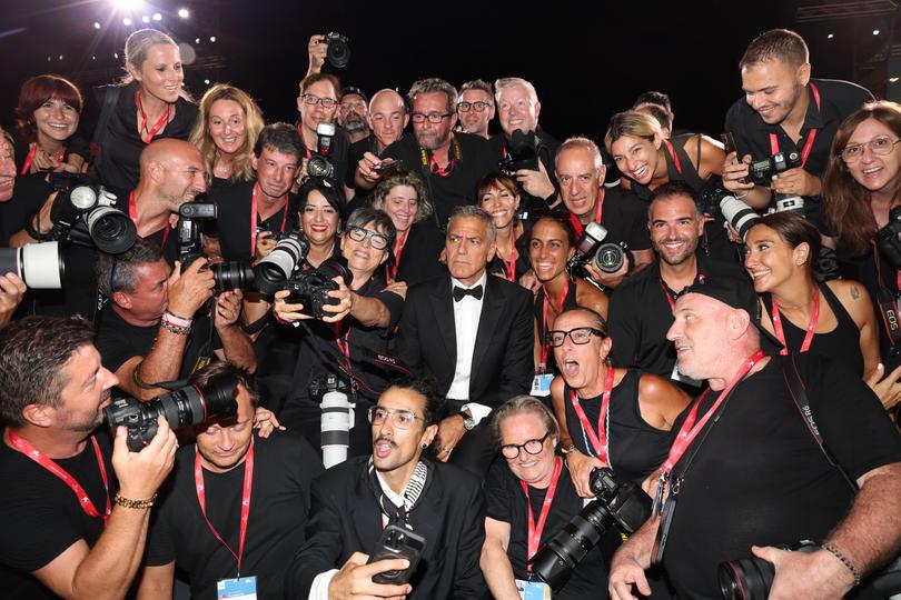 VENICE, ITALY - SEPTEMBER 01: George Cloney poses with photographers as he attends the "Wolfs" red carpet during the 81st Venice International Film Festival on September 01, 2024 in Venice, Italy. (Photo by Pascal Le Segretain/Getty Images)