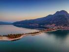 Aerial view of Eğirdir city situated on narrow spit down the big mountain on Eğirdir lake, Turkey Sergey Alimov