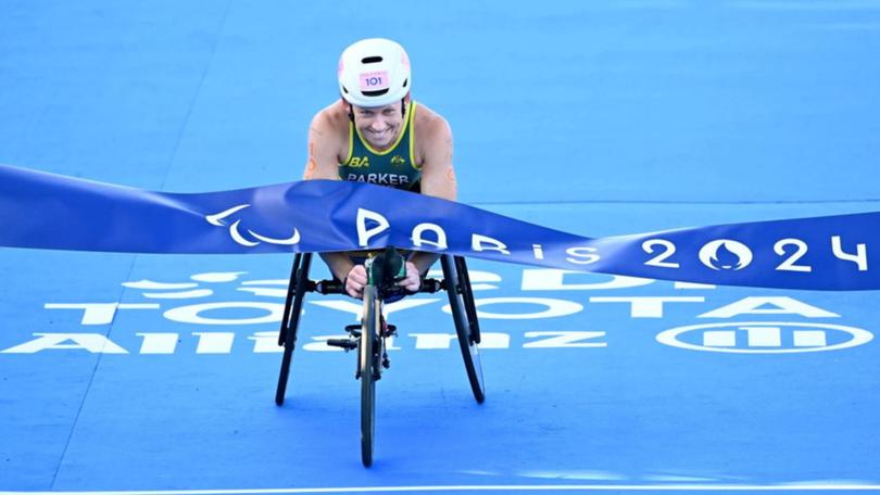 Australia's Lauren Parker has claimed gold in the PTWC triathlon at the Paralympics in Paris. (Delly Carr/AAP PHOTOS)