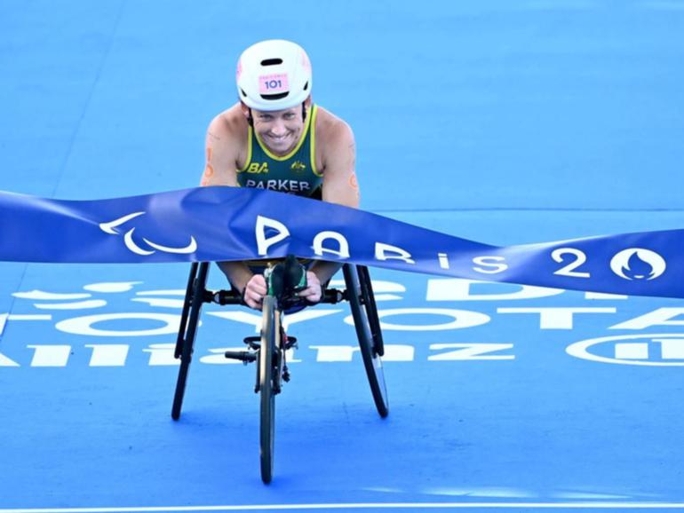 Australia's Lauren Parker has claimed gold in the PTWC triathlon at the Paralympics in Paris. (Delly Carr/AAP PHOTOS)