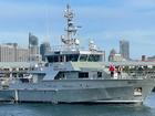 NSW water police vessel Nemesis is heading towards  a stricken yacht carrying two people. (Jack Gramenz/AAP PHOTOS)