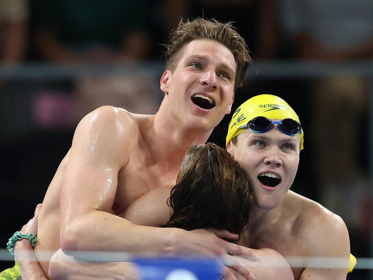 Jesse Aungles, Timothy Hodge, Emily Beecroft and Alexa Leary of Team Australia react after the Mixed 4x100m Medley Relay.