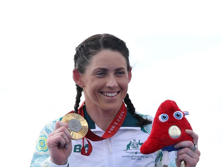 Gold medalist Lauren Parker of Team Australia poses for a photo during the Women's PTWC Para Triathlon Medal Ceremony.