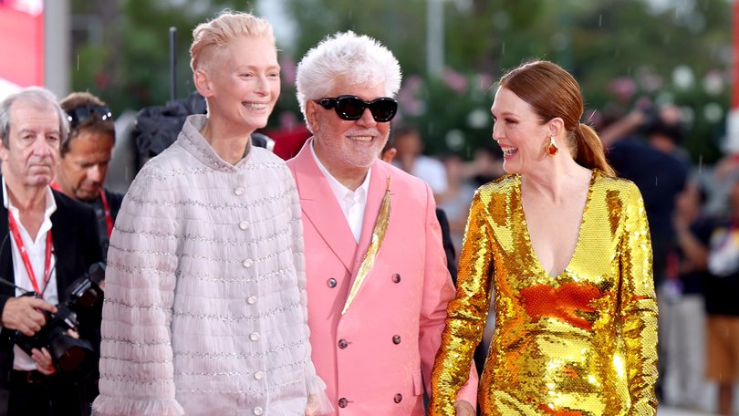 Pedro Almodovar flanked by his stars Tilda Swinton and Julianne Moore at the premiere of The Room Next Door at Venice.