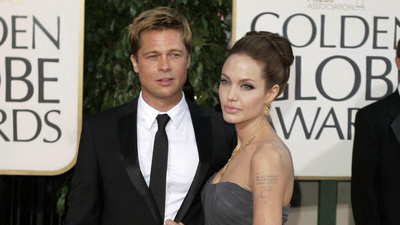 Brad Pitt and Angelina Jolie at the Golden Globe Awards in 2007, the same year they appeared together at the Venice Film Festival. 