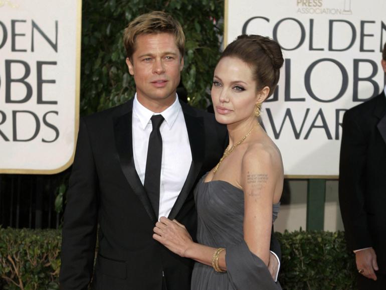 Brad Pitt and Angelina Jolie at the Golden Globe Awards in 2007, the same year they appeared together at the Venice Film Festival. 