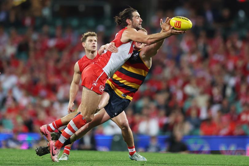 SYDNEY, AUSTRALIA - AUGUST 24: Brodie Grundy of the Swans and Reilly O'Brien of the Crows compete at a ruck during the round 24 AFL match between Sydney Swans and Adelaide Crows at Sydney Cricket Ground, on August 24, 2024, in Sydney, Australia. (Photo by Mark Metcalfe/AFL Photos/via Getty Images)