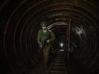 An Israeli soldier walks out of a Hamas tunnel during an escorted tour organized by the military for international journalists, in the Gaza Strip on Dec. 15, 2023. Hamas leaders spent years developing an underground warfare plan. 