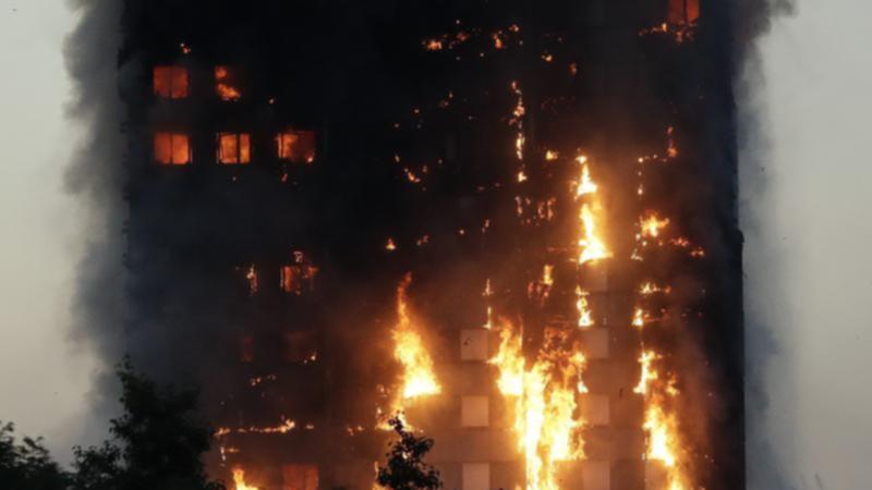 Footage of the Grenfell Tower fire was played to the court on the first day of the class action. (AP PHOTO)