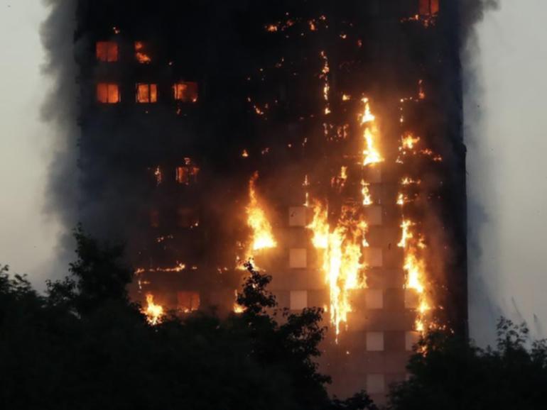 Footage of the Grenfell Tower fire was played to the court on the first day of the class action. (AP PHOTO)