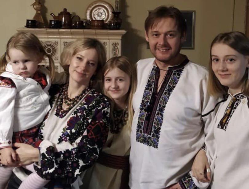 The family are pictured wearing vyshyvanka, the traditional Ukrainian national costume.