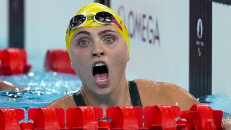 Australia's Alexa Leary is stunned to see her world record time in winning 100m freestyle S9 gold.