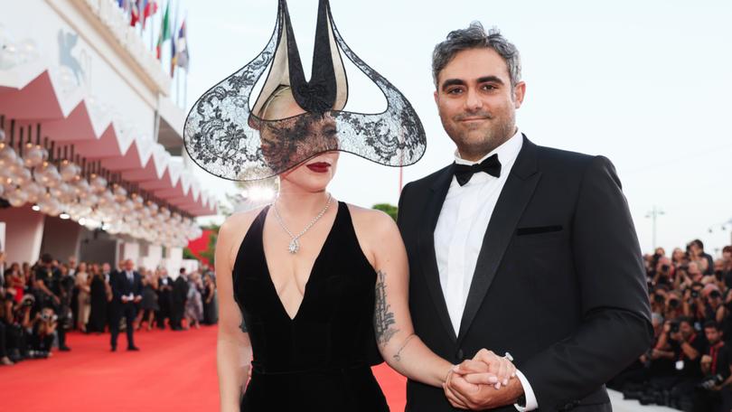 Lady Gaga and Michael Polansky attend the Joker: Folie à Deux red carpet during the 81st Venice International Film Festival at Sala Grande.