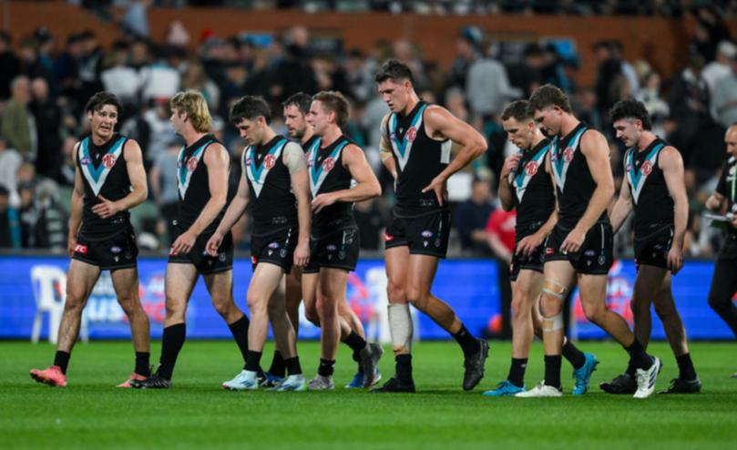 Port Adelaide players could not stop the onslaught.