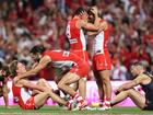 SYDNEY, AUSTRALIA - SEPTEMBER 07: Isaac Heeney of the Swans and Brodie Grundy of the Swans, Will Hayward of the Swans and James Rowbottom of the Swans celebrate winning the AFL First Qualifying Final match between Sydney Swans and Greater Western Sydney Giants at Sydney Cricket Ground, on September 07, 2024, in Sydney, Australia. (Photo by Cameron Spencer/Getty Images)