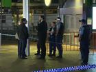 A man has been stabbed while attempting to help a woman during an alleged assault in Sydney.