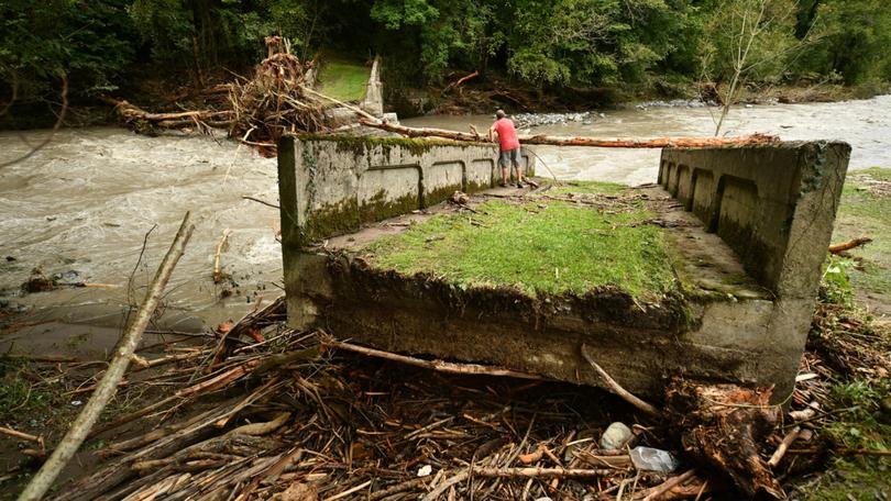 A resident stands on a broken bridge in Cette-Eygun in France’s south-west after flooding caused by the waters of the Gave d'Aspe following heavy rain.