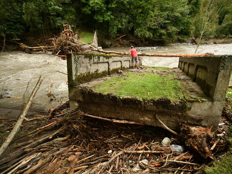 A resident stands on a broken bridge in Cette-Eygun in France’s south-west after flooding caused by the waters of the Gave d'Aspe following heavy rain.