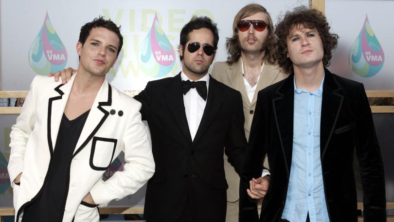 The band "The Killers" pose for photographers as they arrive on the white carpet of the 2005 MTV Video Music Awards in Miami.