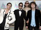 The band "The Killers" pose for photographers as they arrive on the white carpet of the 2005 MTV Video Music Awards in Miami.