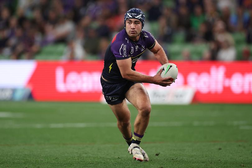 MELBOURNE, AUSTRALIA - AUGUST 24: Jahrome Hughes of the Storm looks to pass the ball during the round 25 NRL match between Melbourne Storm and Dolphins at AAMI Park, on August 24, 2024, in Melbourne, Australia. (Photo by Daniel Pockett/Getty Images)