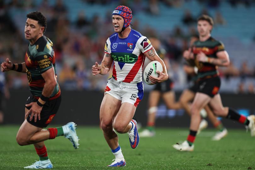 SYDNEY, AUSTRALIA - AUGUST 24:  Kalyn Ponga of the Knights makes a break during the round 25 NRL match between South Sydney Rabbitohs and Newcastle Knights at Accor Stadium, on August 24, 2024, in Sydney, Australia. (Photo by Matt King/Getty Images)