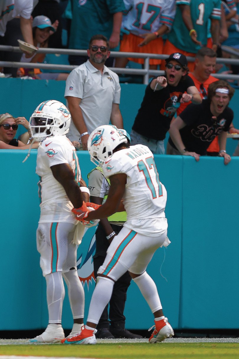 MIAMI GARDENS, FLORIDA - SEPTEMBER 08: Tyreek Hill #10 of the Miami Dolphins and Jaylen Waddle #17 of the Miami Dolphins celebrate after Hill's receiving touchdown during the third quarter against the Jacksonville Jaguars at Hard Rock Stadium on September 08, 2024 in Miami Gardens, Florida. (Photo by Megan Briggs/Getty Images)