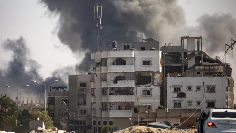 Smoke rises following an Israeli air strike in Gaza.