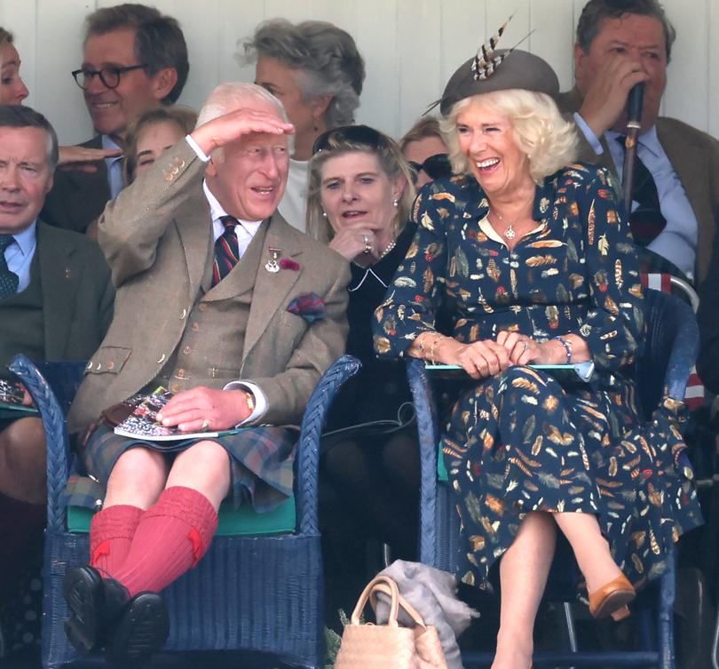 BRAEMAR, SCOTLAND - SEPTEMBER 08: King Charles III and Queen Camilla laugh as they sit in the Royal box and attend The Braemar Gathering 2024 at The Princess Royal and Duke of Fife Memorial Park on September 08, 2024 in Braemar, Scotland. The Braemar Gathering, renowned globally, is the most famous of the Highland Games. Every year, on the first Saturday in September, this vibrant Scottish tradition draws thousands of visitors to the small village of Braemar. With a history spanning nearly two centuries in its modern form, the Gathering stands as one of Scotland's most celebrated events. (Photo by Chris Jackson/Getty Images)