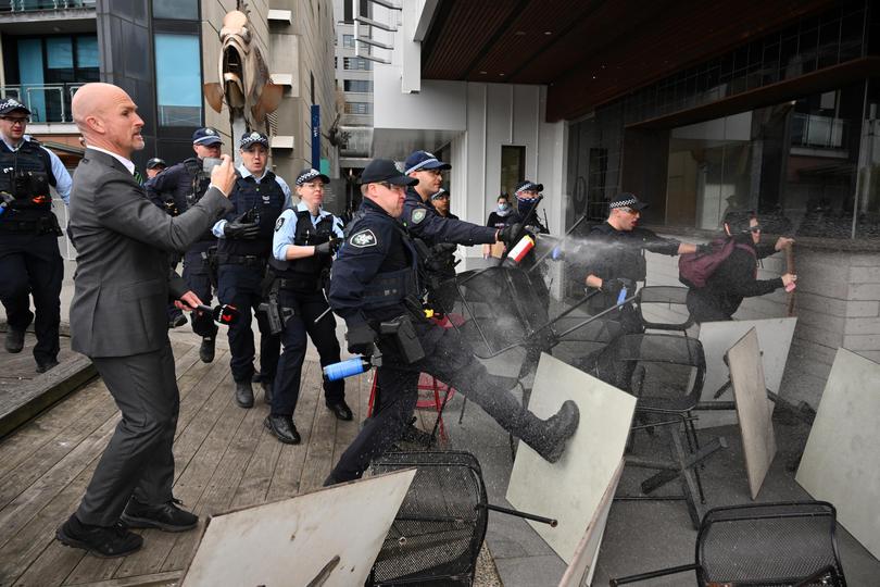 Victoria Police deploy OC spray on protesters.