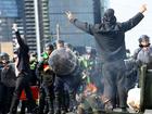 Protesters confront police during an anti-war rally outside a weapons expo in Melbourne.