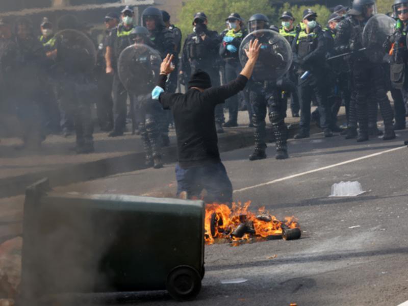 Protester in front of police