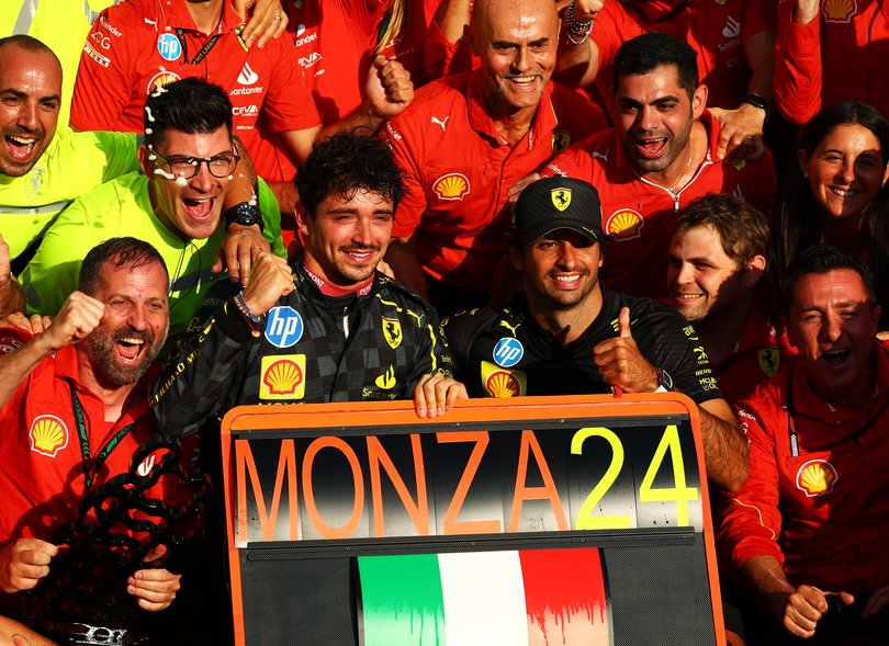 Race winner Charles Leclerc of Monaco and Ferrari and Fourth placed Carlos Sainz of Spain and Ferrari celebrate with the team.