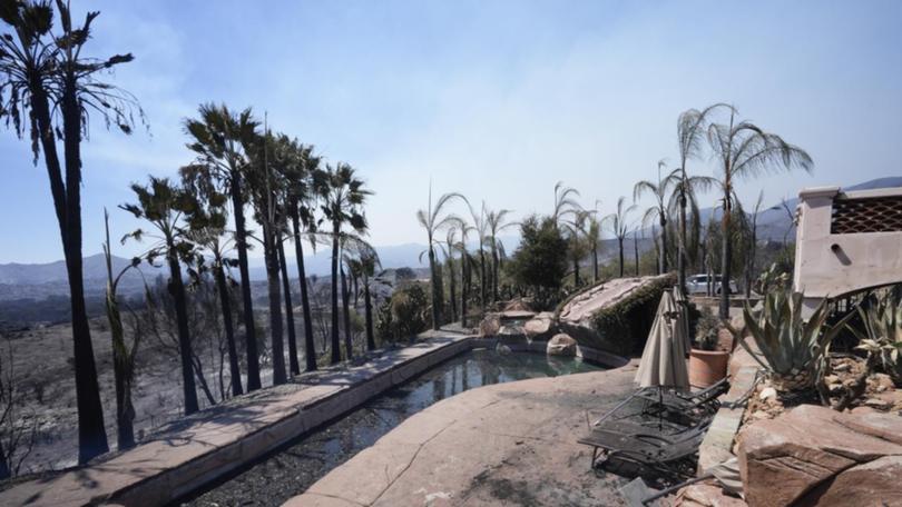 A fire-ravaged property at El Cariso Village, Riverside in California.