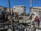 Palestinians search for missing people under the rubble of a destroyed UNRWA-run school, a school-turned-shelter known as al-Jaouni, following an Israeli air strike in Al-Nuseirat refugee camp, central Gaza Strip, 11 September 2024. TEPA/MOHAMMED SABER