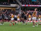 Power players celebrate amid dejection for the Hawks after a dramatic Adelaide Oval clash. (Matt Turner/AAP PHOTOS)