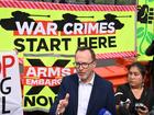 Greens Senator David Shoebridge speaks during a protest against the LandForces International Land Defence Exposition.