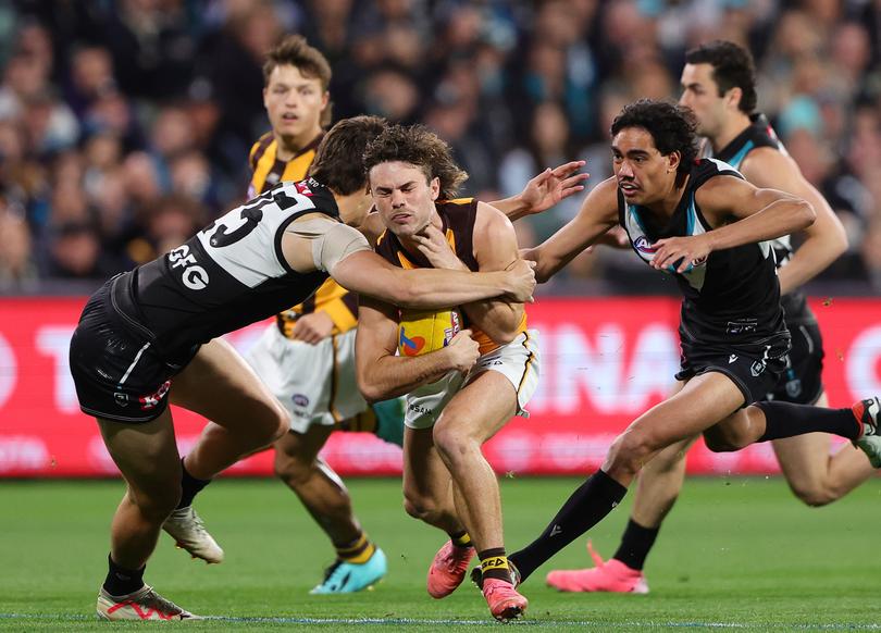 ADELAIDE, AUSTRALIA - SEPTEMBER 13: Nick Watson of the Hawks is tackled by Brandon Zerk-Thatcher of the Power during the 2024 AFL Second Semi Final match between the Port Adelaide Power and the Hawthorn Hawks at Adelaide Oval on September 13, 2024 in Adelaide, Australia. (Photo by Sarah Reed/AFL Photos via Getty Images)